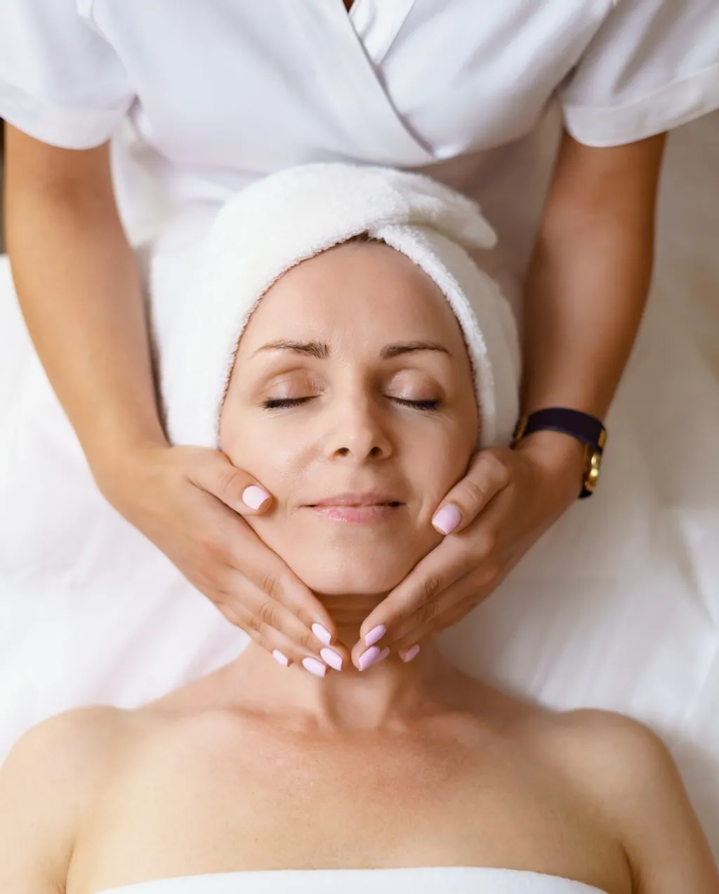 A client relaxing during a facial treatment